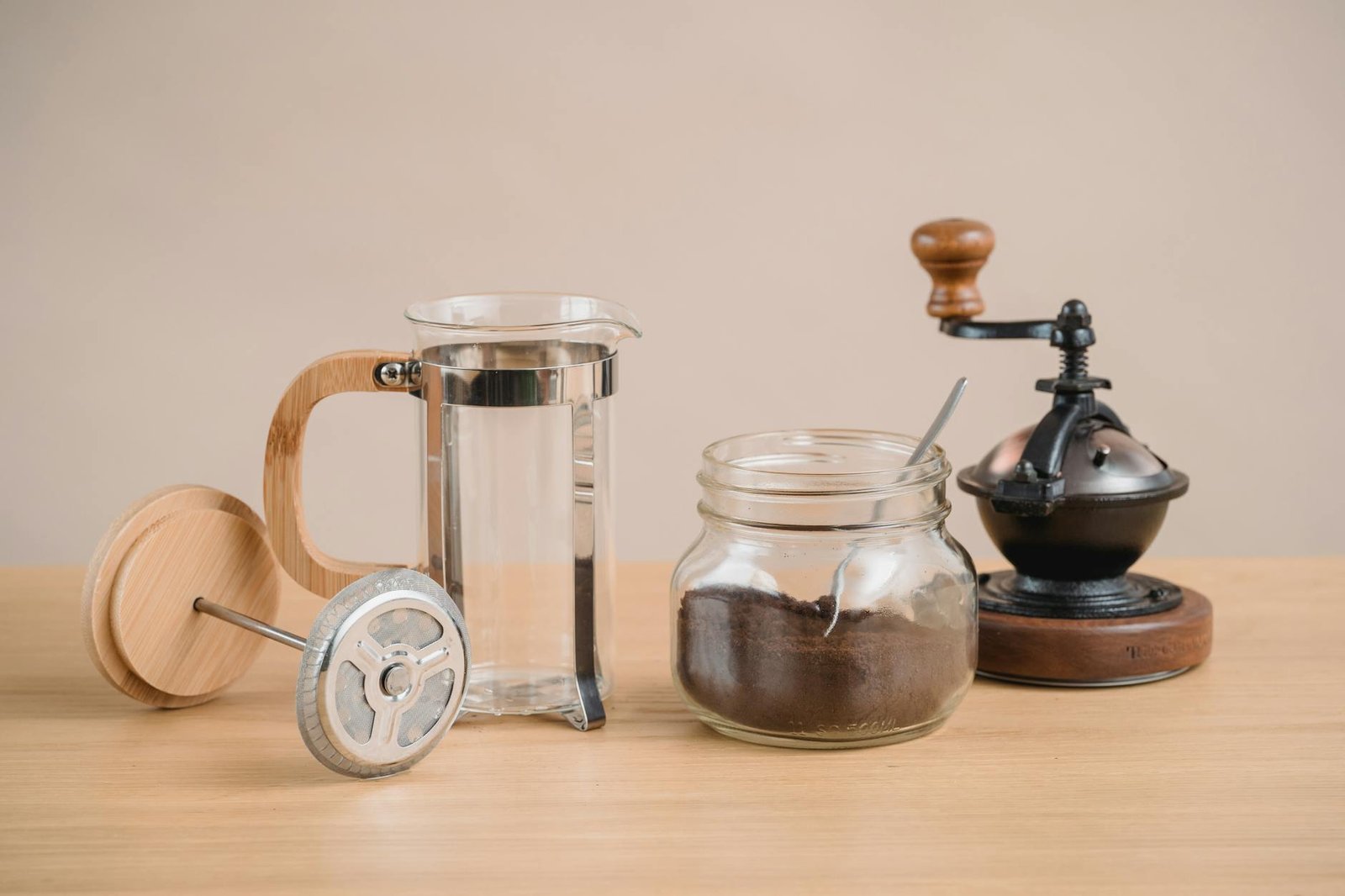 coffee grinder jar with coffee and glass