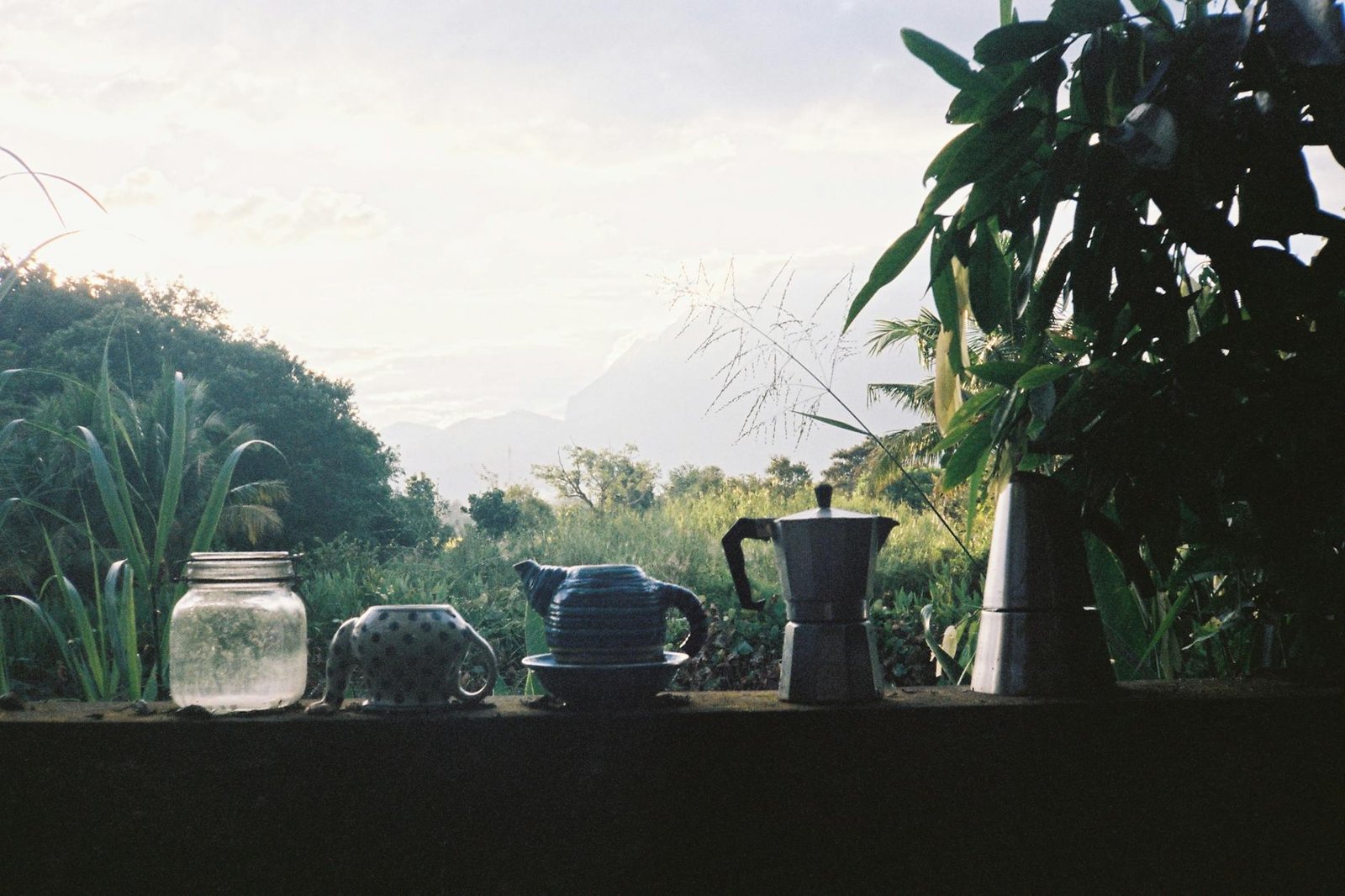 tranquil morning setup with coffee makers outdoors